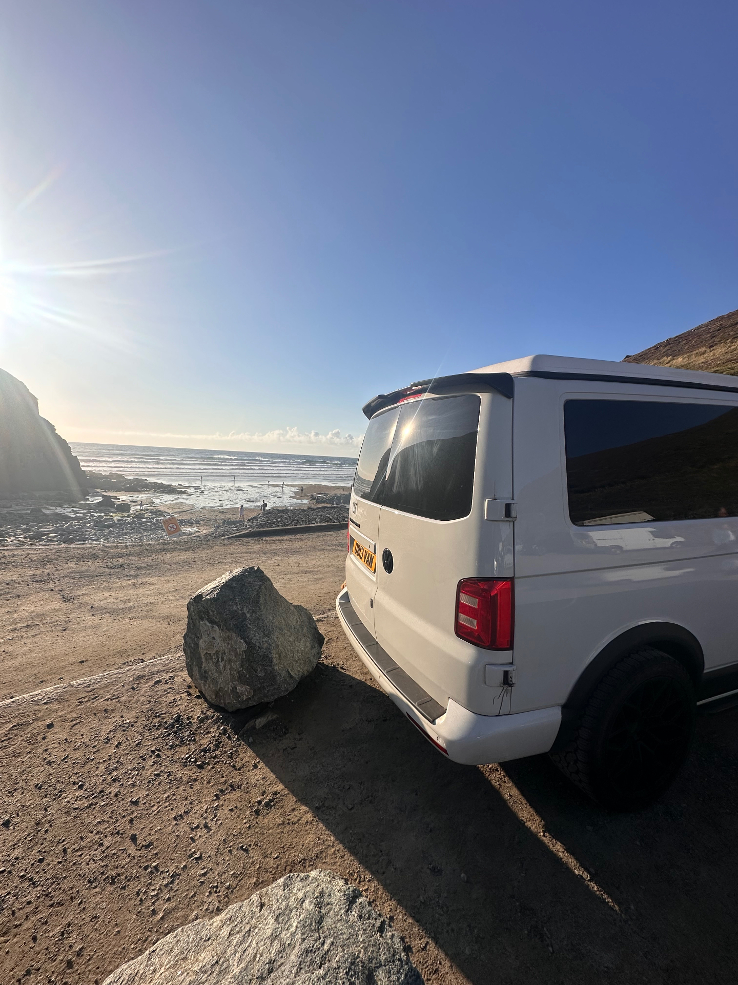 OB13VAN parked beside the coast on a road trip