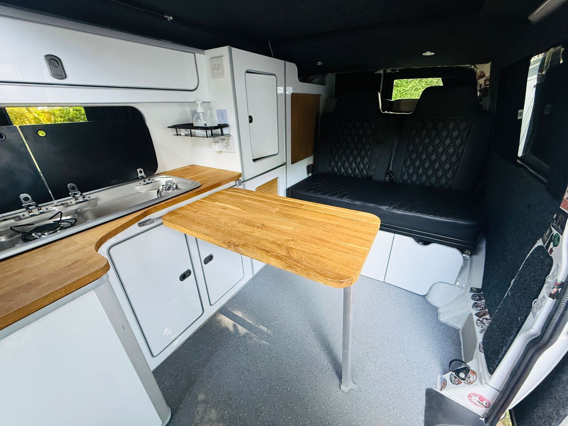 Dining table and kitchen inside the OB13VAN campervan